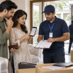 Couple reviewing documents with a moving professional to verify packers and movers in India before paying an advance.